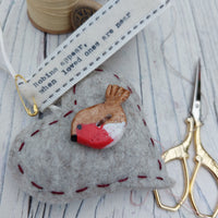 Small felt heart with clay robin