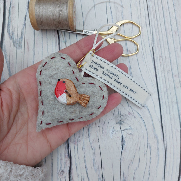 Small felt heart with clay robin