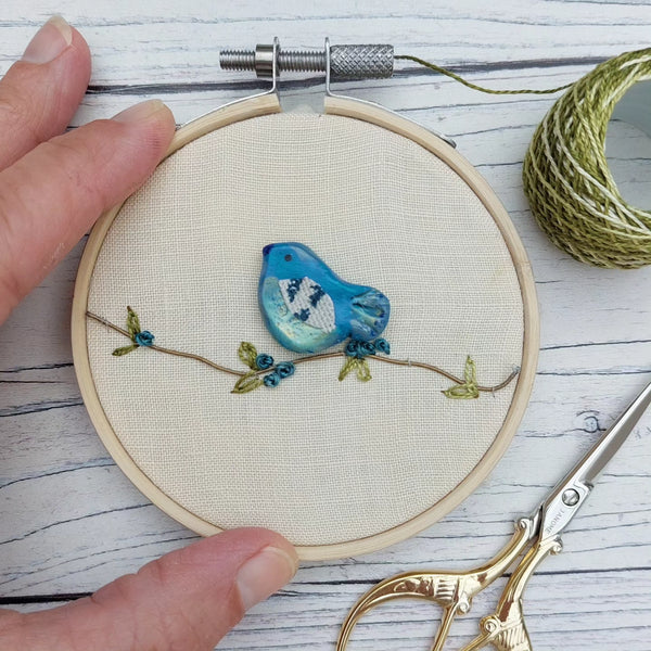 Blue clay bird hoop art