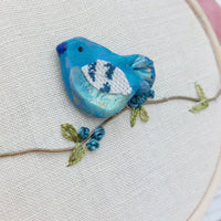 Blue clay bird hoop art