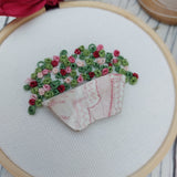 Bowl of flowers. Pottery and embroidery hoop art