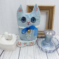 Blue wool cat ornament.