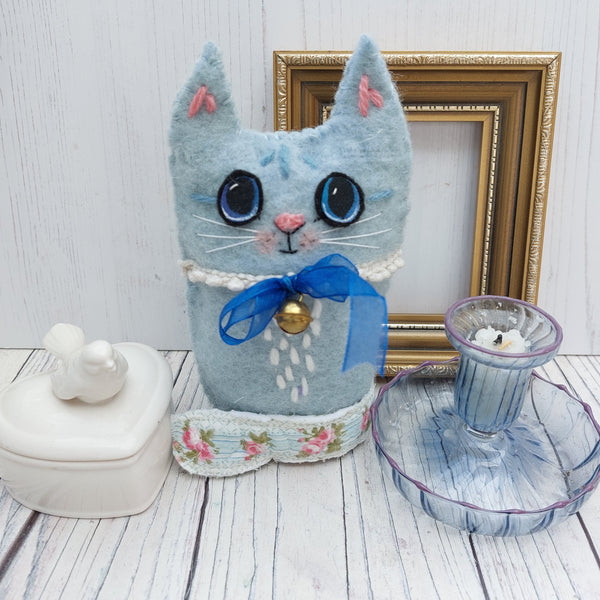 Blue wool cat ornament.
