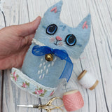 Blue wool cat ornament.