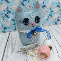 Blue wool cat ornament.
