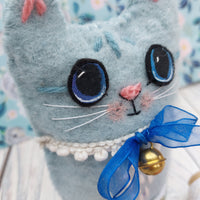 Blue wool cat ornament.