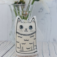 Cute little Bride cat fabric ornament. Drawn onto fabric wearing a veil.