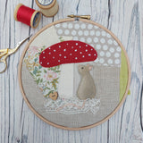 Mouse under a toadstool hoop art.