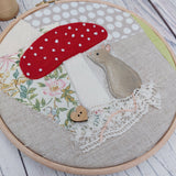 Mouse under a toadstool hoop art.