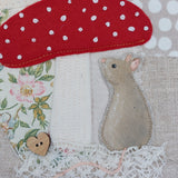 Mouse under a toadstool hoop art.