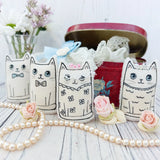 Cute miniature fabric cats wearing wedding clothes